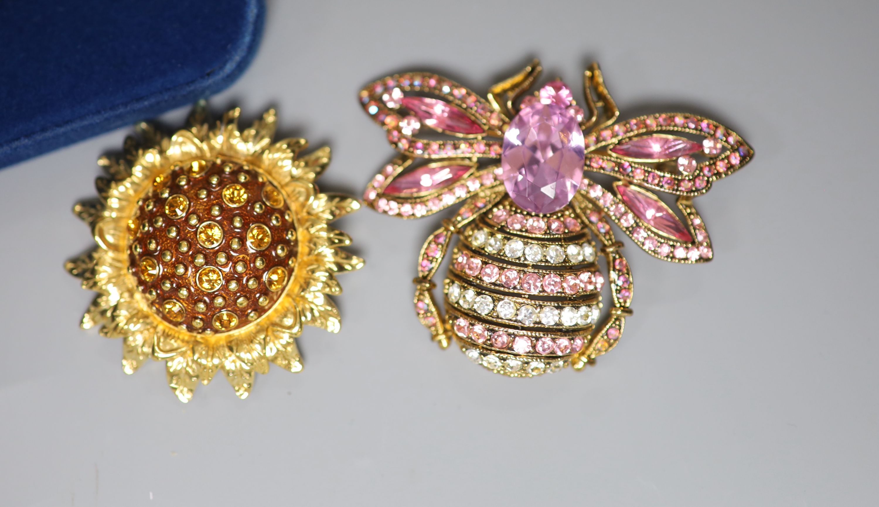 Four items of designer costume jewellery, including a Camrose & Kross 'Jacqueline Kennedy' reproduction flower brooch